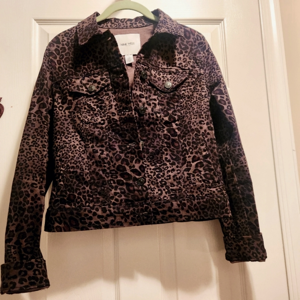 Brand new leopard print denim jacket with brass buttons.